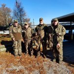 duck hunting group posing with game